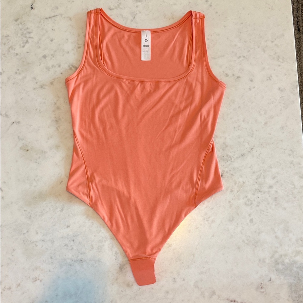 Lululemon Athletica Orange bodysuit small